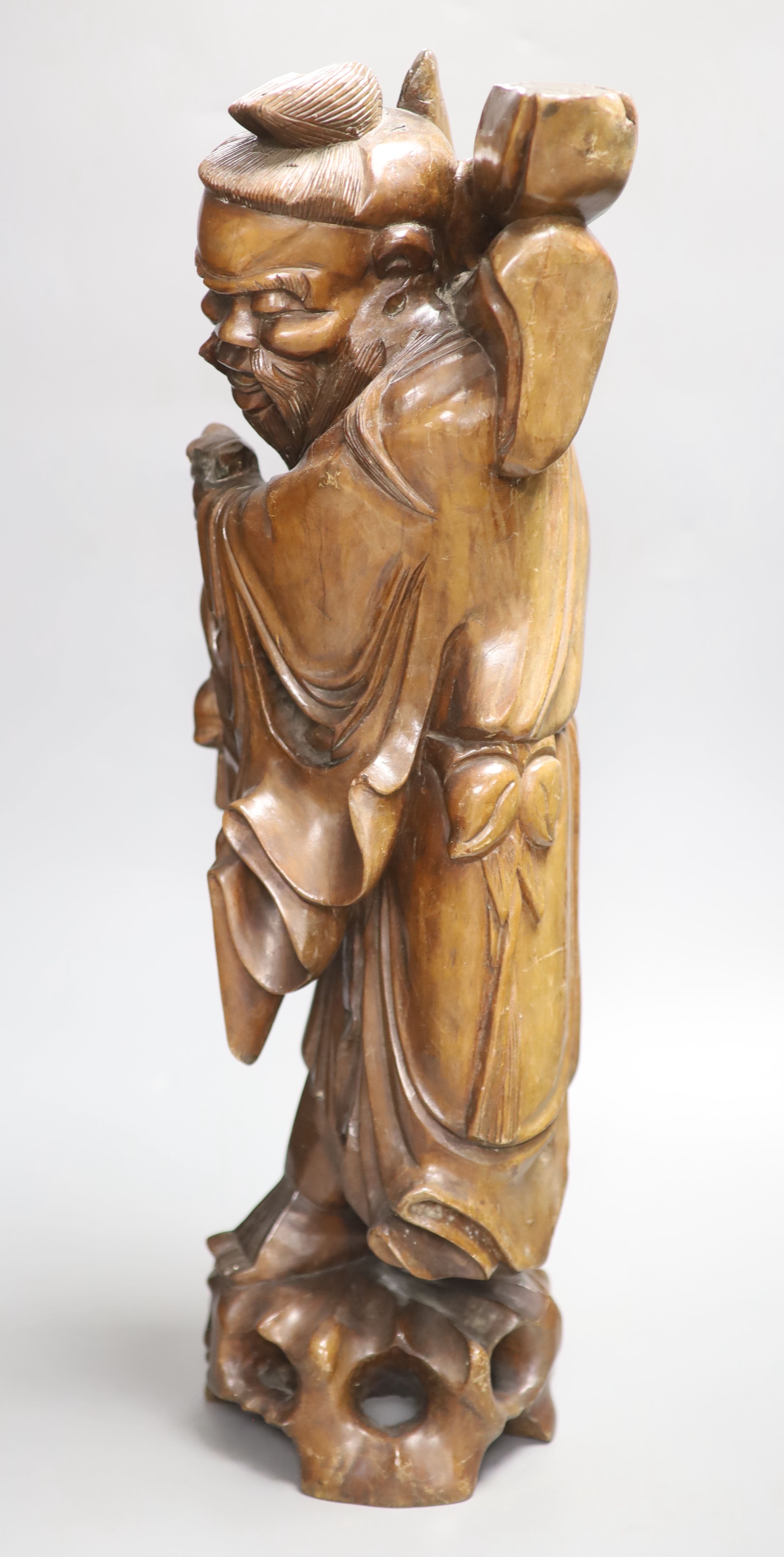 A Chinese hardwood carving of Shou, height 54cm